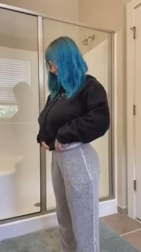 Blue-haired goth babe Alli strips down in the shower, revealing her massive, bouncing tits and perfectly round ass. With each clap of her cheeks, she spreads them wide, teasing the camera with her tight asshole. But that