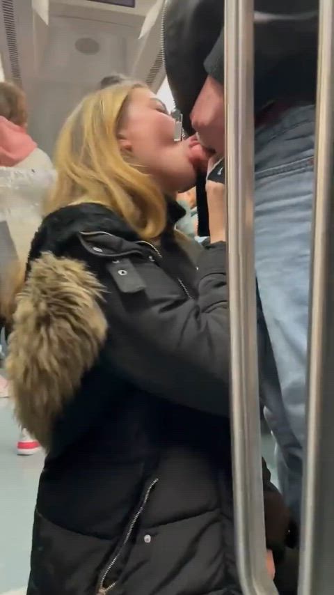 Girl give a blowjob in crowded